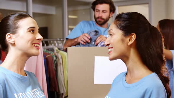Female volunteer giving high five alt