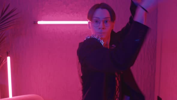 Guy Dancing in Pink Lights alt