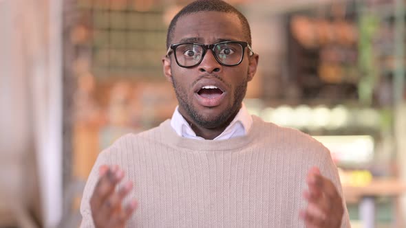 Portrait of Disappointed African Man Reacting To Loss, Failure alt