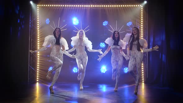 A Modern Choreographic Dance Performed By a Group of Slender Young Women in Tight-fitting Flounced alt