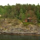 Many Swedish Wooden Sauna Logs Cabins Houses On Island Coast In Summer Cloudy Day - VideoHive Item for Sale