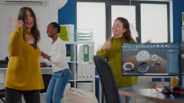 Multiethnic Happy Women Dancing Cheerfully in Startup Business Office alt