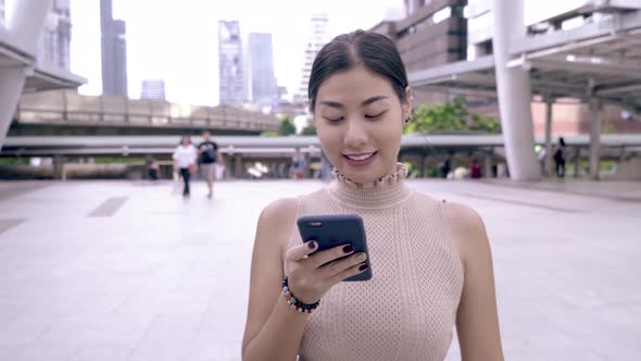 Beautiful Woman Using Smartphone Technology