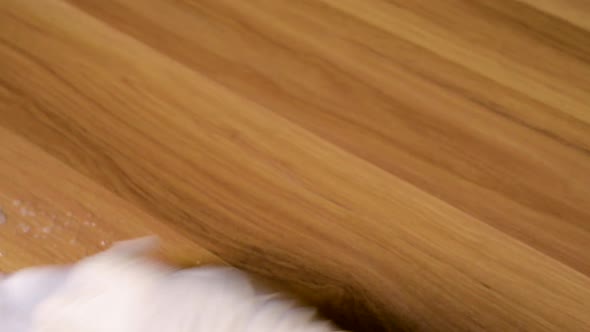 Spraying alcohol on the table and cleaning to disinfect viruses and bacteria alt