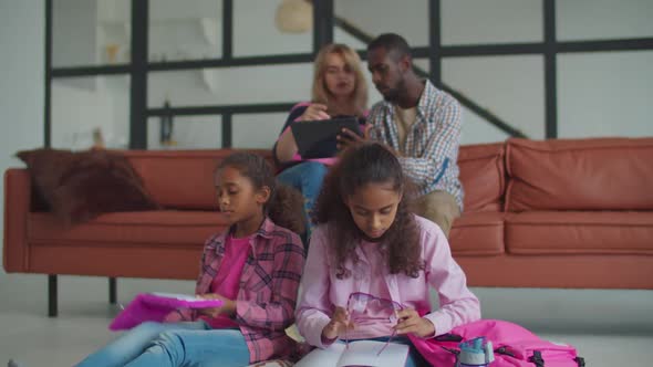 Cute Daughter Asking Parents for Help with Homework alt