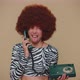 Crazy Girl with Brown Lush Wig Talking on Wired Vintage Telephone of 80s Fooling Making Silly Faces - VideoHive Item for Sale