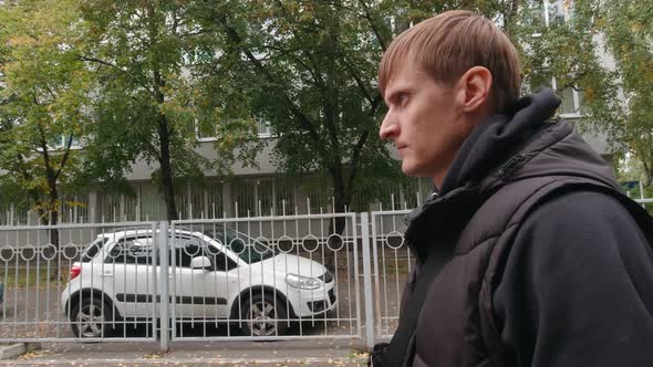 Man Walking In The Parking Lot Slow Motion alt