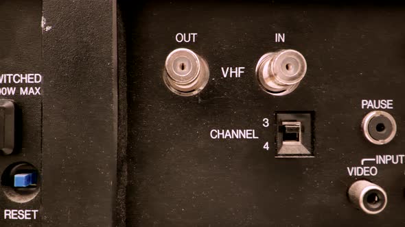 Extreme close up featuring the inputs on the back of a vintage VCR alt