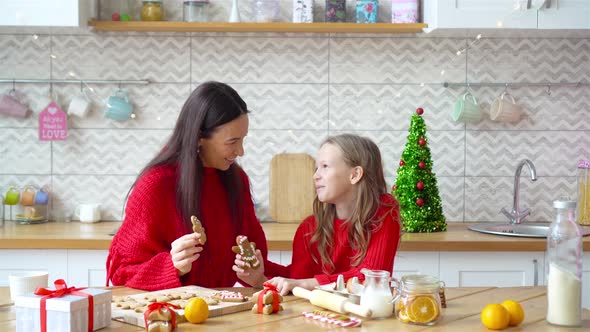 Happy Family Mother and Daughter Bake Cookies for Christmas