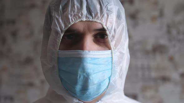 Human Man Doctor in Protective Clothes During Coronavirus Pandemic Portrait