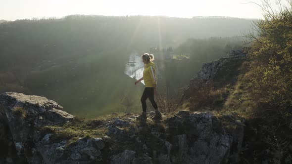 Aerial view of a woman on the rocks, Dinant, Namur, Belgium. alt