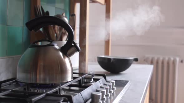 Tea kettle emitting steam