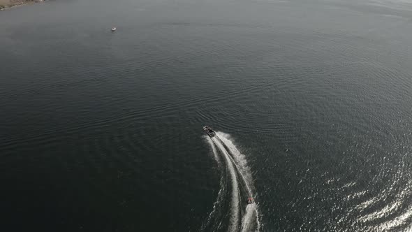 Aerial View of Speedboat with Wake on a Lake