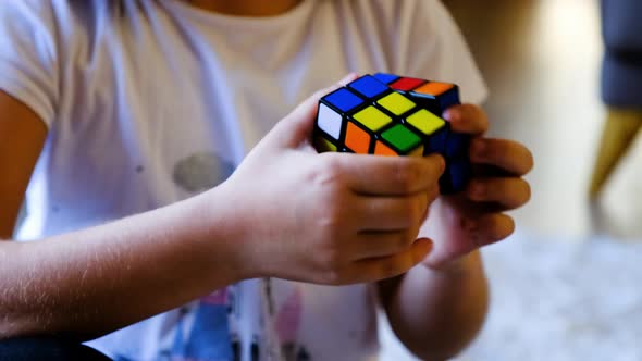 Girl's Hands Solve Rubik's Cube Puzzle by redrec | VideoHive