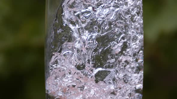 Water being poured into Glass, Slow Motion alt