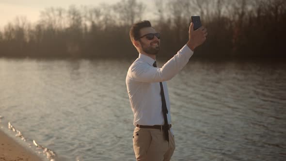 Man Mobile Phone Mobile App And Taking Picture. Traveler Takes Photo Smartphone. alt