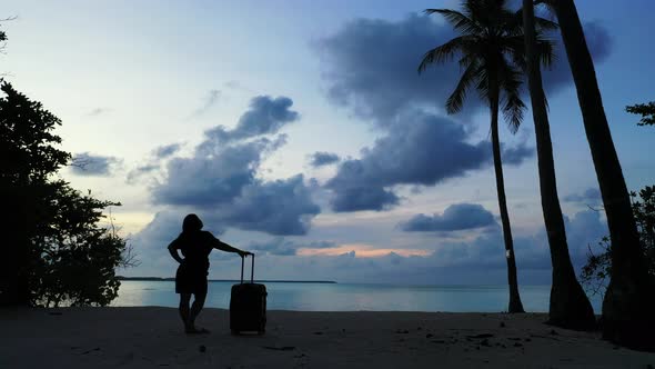 Modern beauty model on holiday in the sun at the beach on paradise white sand and blue  alt