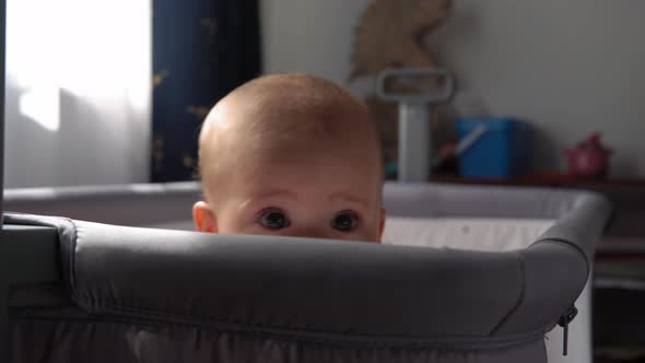 Closeup Cute Kid 10 Month Newborn Boy Looking At Camera After Bath Shower On White Soft Crib
