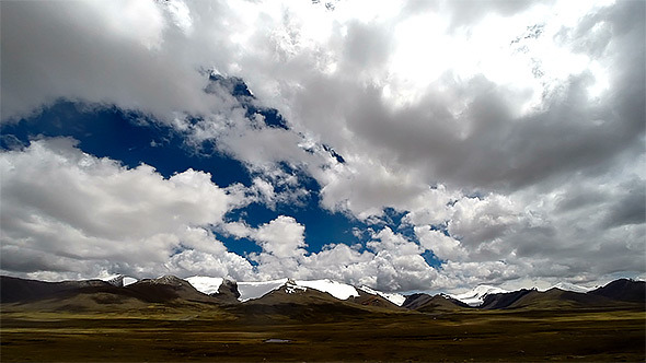 Clouds over a Mountain Field