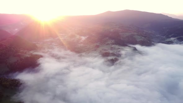 Aerial Drone View of Fog and a Cloud Inversion in a Rural Valley in Mountain Rural Landscape