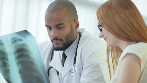 Smiling Doctor Talking To Patient, Stock Footage | VideoHive