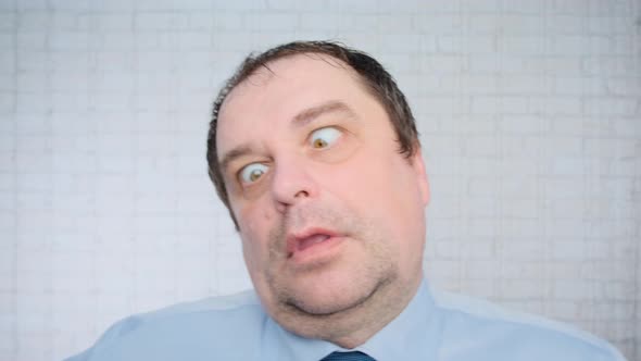 Portrait of adult man losing consciousness alt