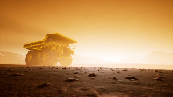 Big Yellow Mining Truck in the Dust at Career