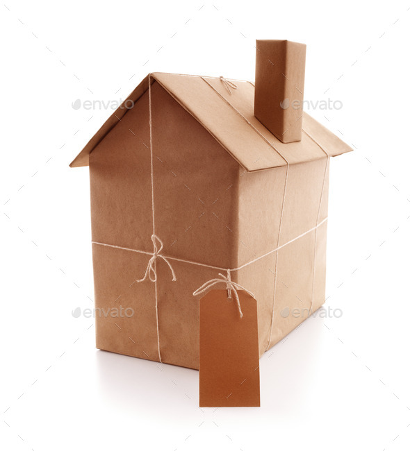 New house wrapped in brown paper - Stock Photo - Images