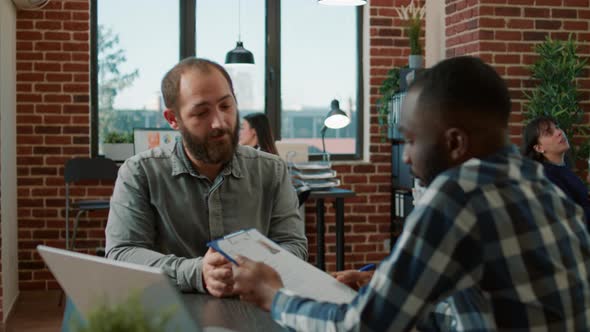 Diverse Group of Men Attending Job Interview to Discuss Hiring alt