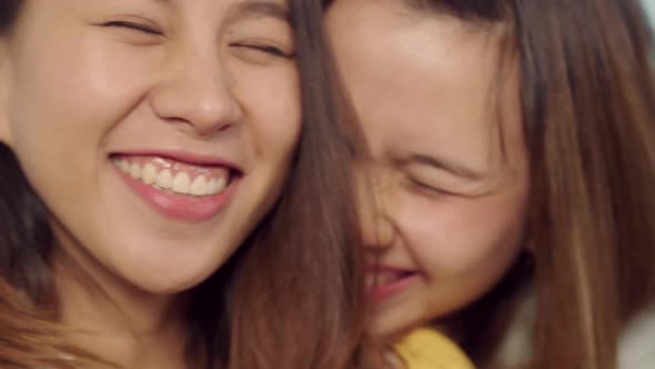 Asian blogger women using smartphone selfie and recording vlog video in living room at home. alt