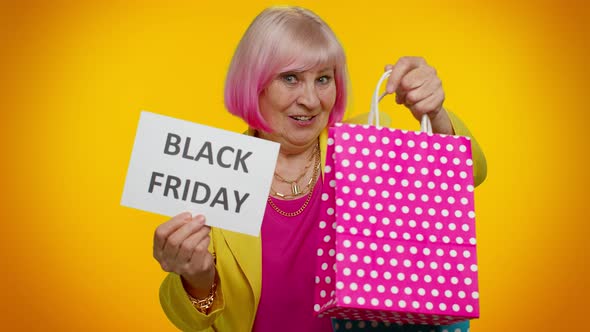 Elderly Granny Woman Showing Black Friday Inscription Banner Text Advertising Discounts Low Prices alt