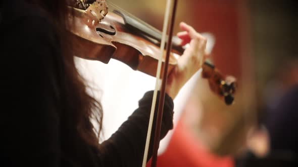 Person performing on a violin