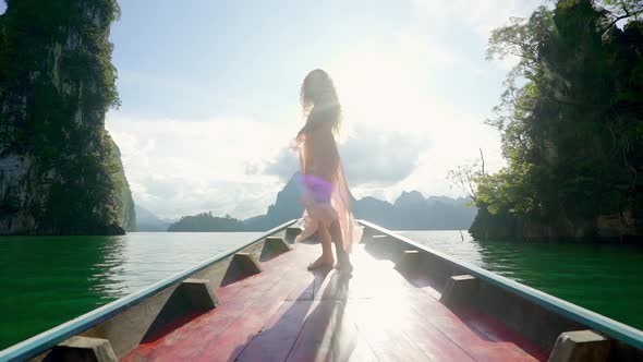Girl Standing on a Boat alt
