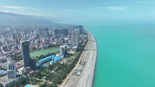 Aerial view of beautiful lake in the center of Batumi. flying over 6 May park. Georgia 2022 summer alt