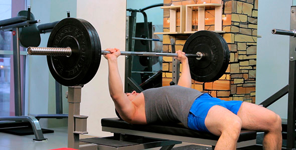 Man Does Bench Press Barbell 1