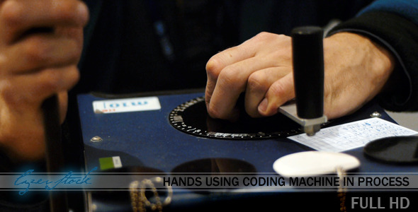 Hands Using Coding Machine In Process