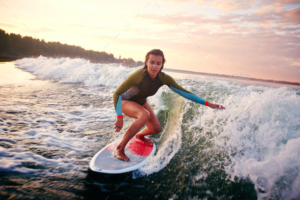 Woman surfboarding - Stock Photo - Images