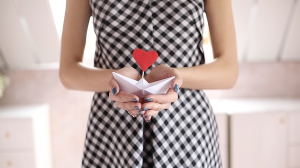 Woman Showing Her Love With A Heart On Ship