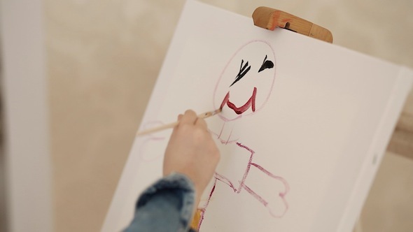 Little Girl Drawing A Smile Of Her Father