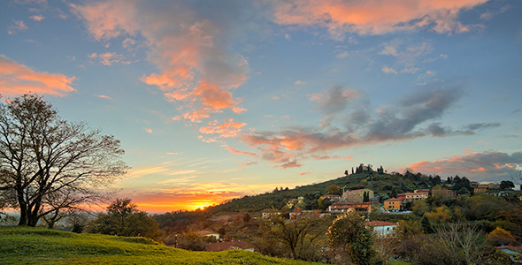 Colorful Sunset over Hillside Town