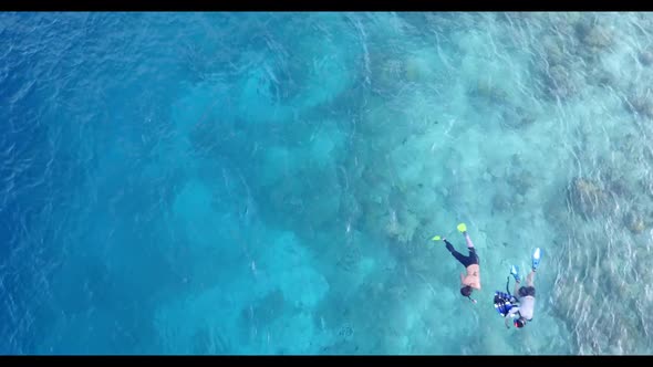 Romantic couple engaged on paradise lagoon beach break by blue lagoon with white sand background of  alt