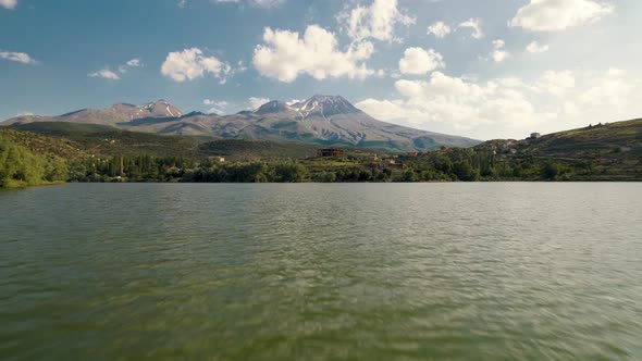 Drone Flies Forward Very Close to Lake Surface