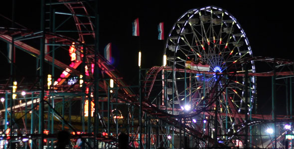 Roller Coaster And Ferris Wheel At Night