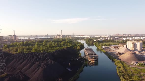 Steel Mill Coal In Zug Island, Detroit Michigan Near The River Rouge Surrounded By Green Trees And P alt