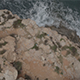 Rocky Coast and Sailboat out at Sea, Aerial Drone - VideoHive Item for Sale