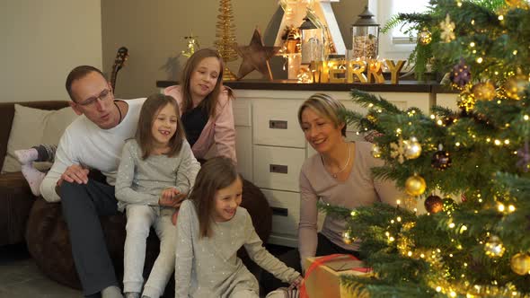Happy Family at Christmas Tree
