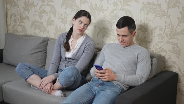 Husband Pays No Attention to His Wife and Keeping Play Game on Smartphone alt