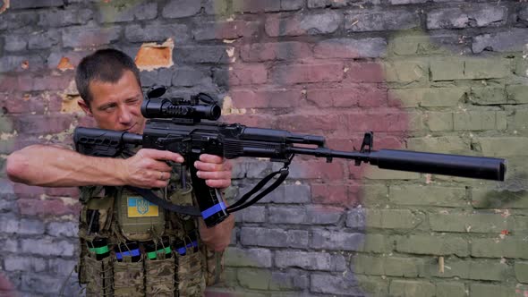 The Ukrainian Soldier Takes Aim with His Assault Rifle with Silencer alt