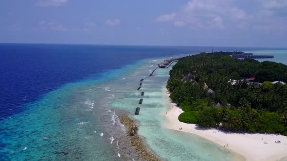Aerial panorama of seashore beach voyage by blue ocean with sand background alt