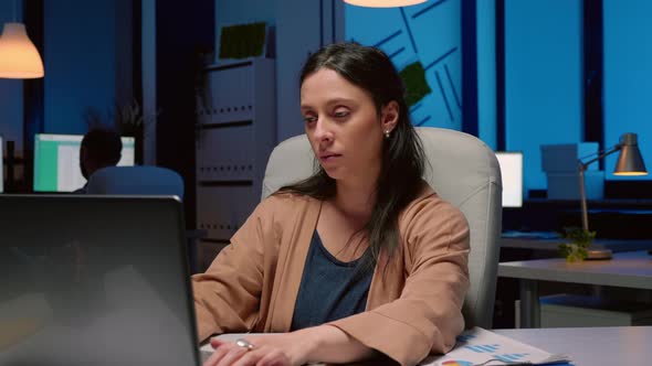 Portrait of Tired Workaholic Entrepreneur Analyzing Financial Statistics alt